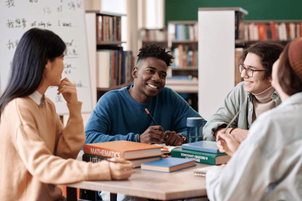 Young man smiling during group discussion